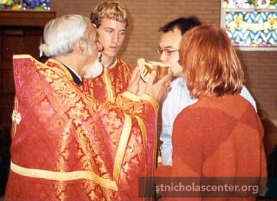 Priest passing bread Priest passing bread